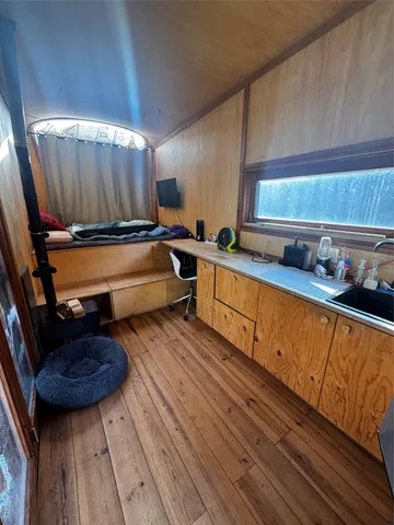 a kitchen with wooden cabinets and a sink