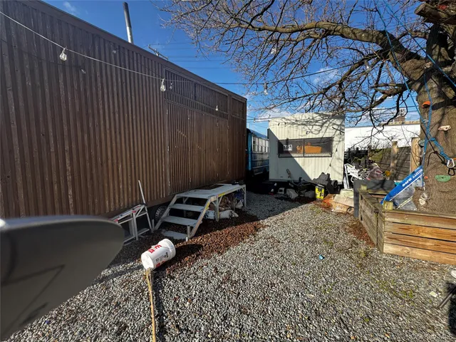 a view of a backyard with a sitting area
