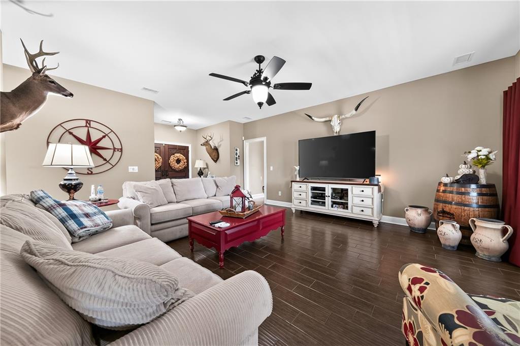 611 Padgetts Road Opelika, AL 36804 - Photo 7 of 64 Wood-finish flooring throughout the room with a ceiling fan overhead