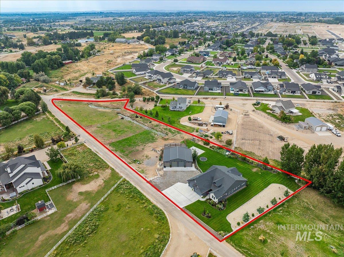24301 Wanda Way Middleton, ID 83644 - Photo 2 of 50 Aerial view of residential area with property boundaries highlighted