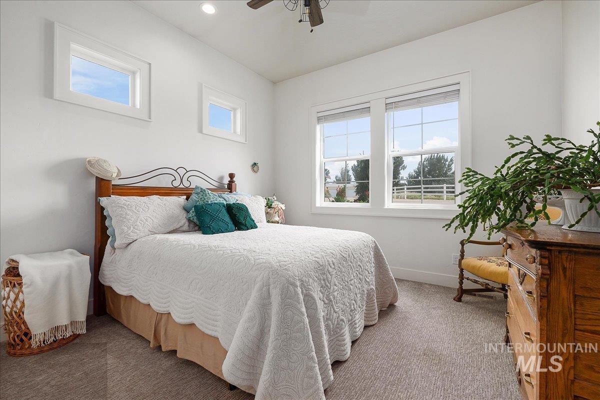 24301 Wanda Way Middleton, ID 83644 - Photo 23 of 50 Carpeted bedroom featuring baseboards and a ceiling fan