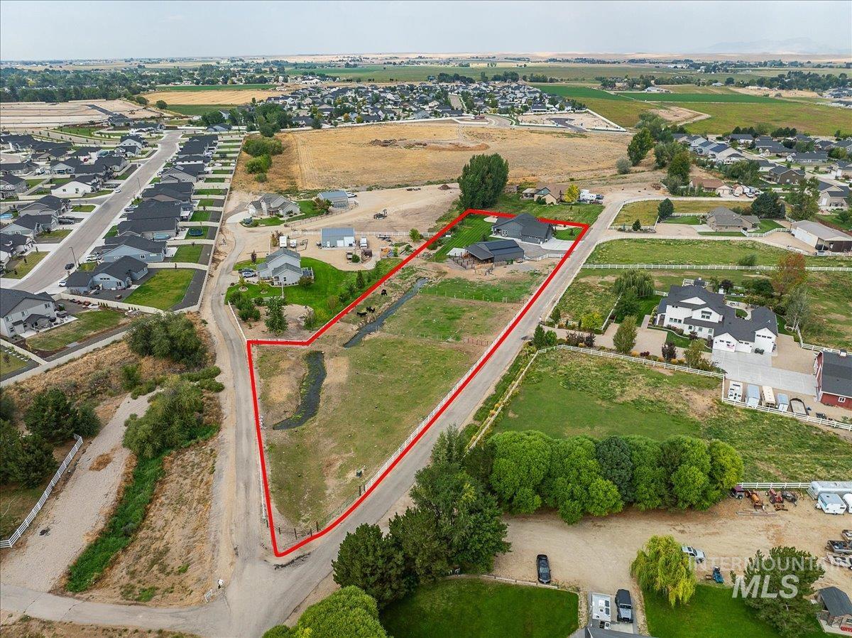 24301 Wanda Way Middleton, ID 83644 - Photo 6 of 50 Aerial view of property's location featuring property parcel outlined and nearby suburban area