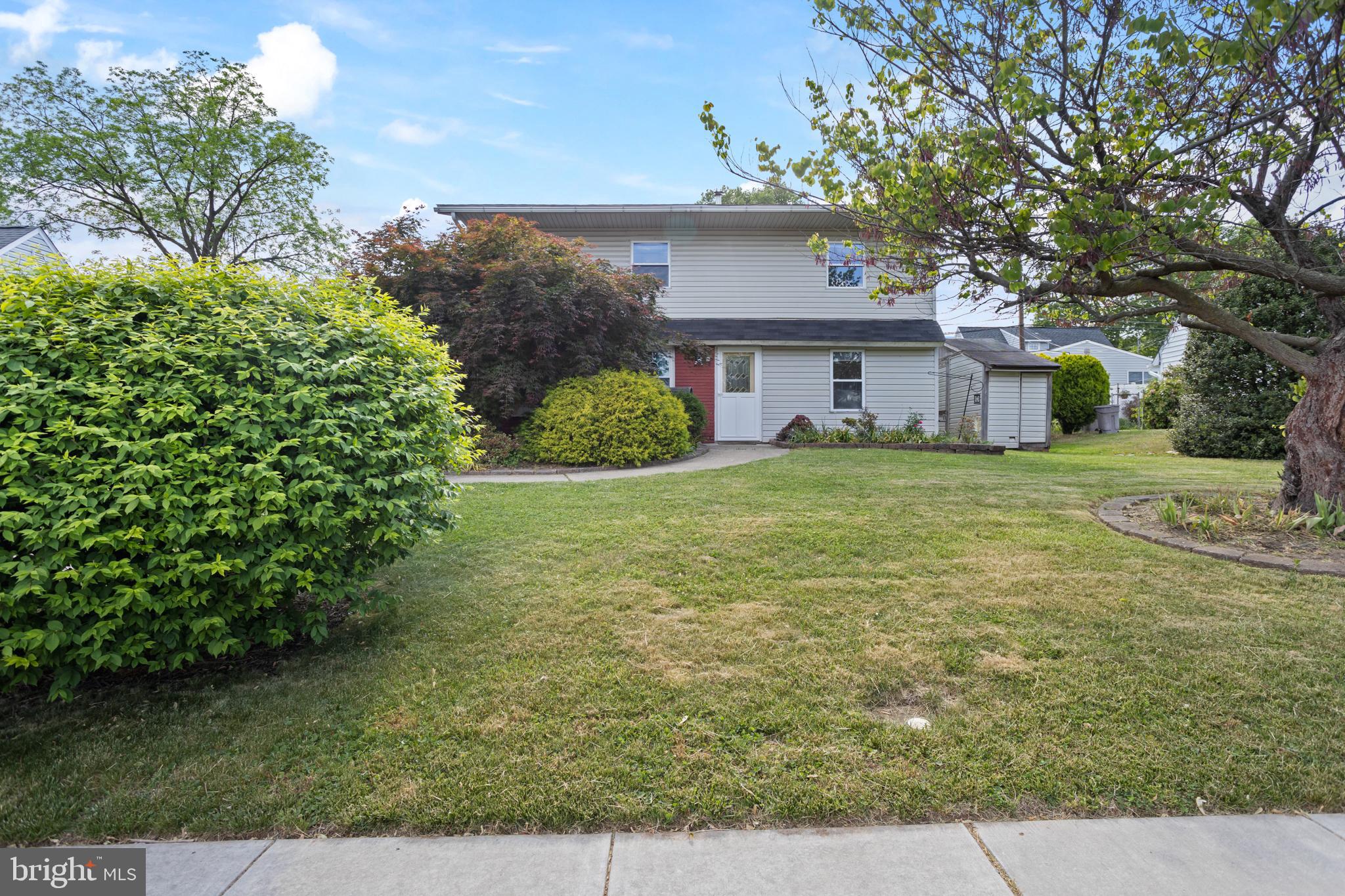 23 Cotton Road Levittown, PA 19057 - Photo 2 of 36 a house view with a garden space