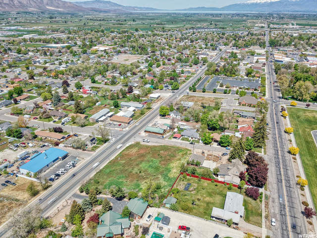 450 South 100 Street West Payson, UT 84651 - Photo 6 of 7 Aerial view of property and surrounding area with property boundaries highlighted and a mountainous background