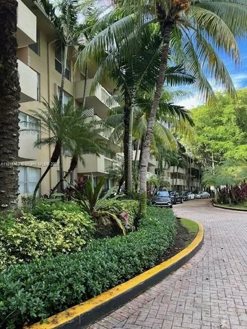 a view of a garden with a fountain