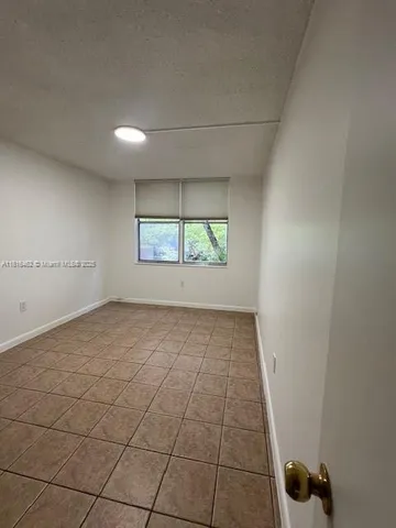 a white kitchen with cabinets and white appliances