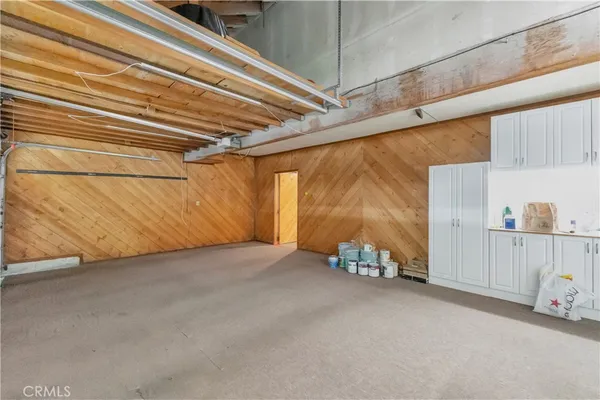 a large kitchen with stainless steel appliances lots of counter top space
