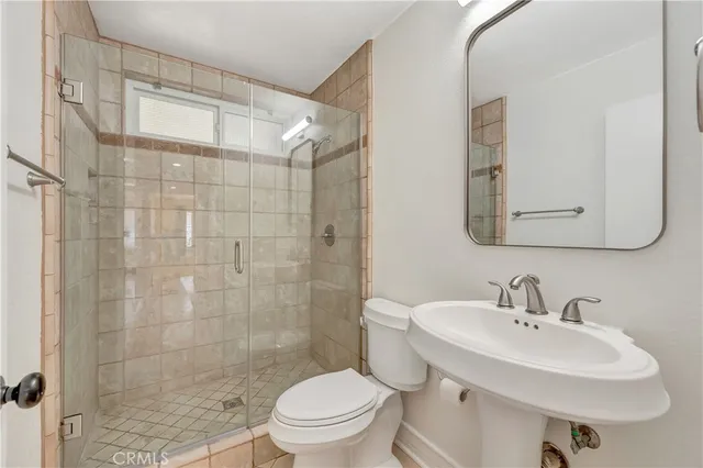 an aerial view of multiple houses with yard