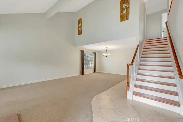 a kitchen with stainless steel appliances granite countertop a stove a sink a microwave and a refrigerator