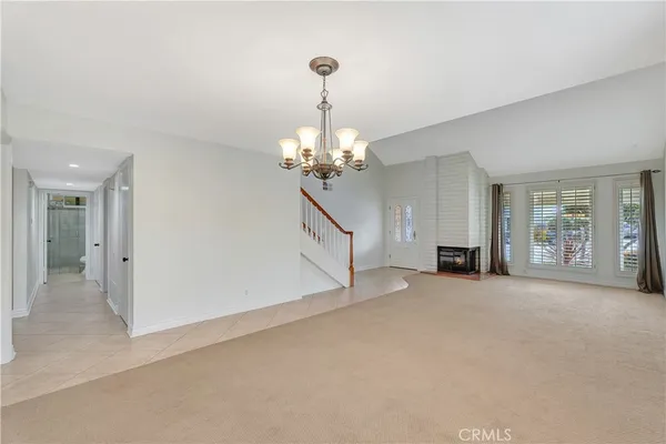 a kitchen with stainless steel appliances granite countertop a stove a sink a microwave and a refrigerator