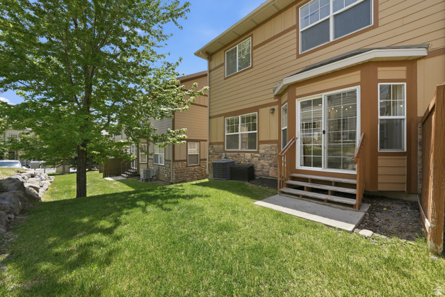 14771 Haddington Road Draper, UT 84020 - Photo 33 of 44 Rear exterior with sliding glass door access to the yard
