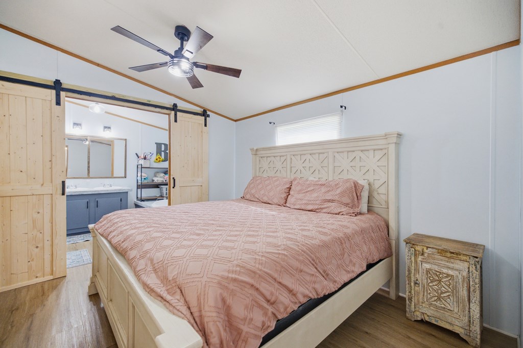 503 Whitten Road Waterloo, SC 29384 - Photo 9 of 31 a bedroom with a large bed dresser and wooden floor