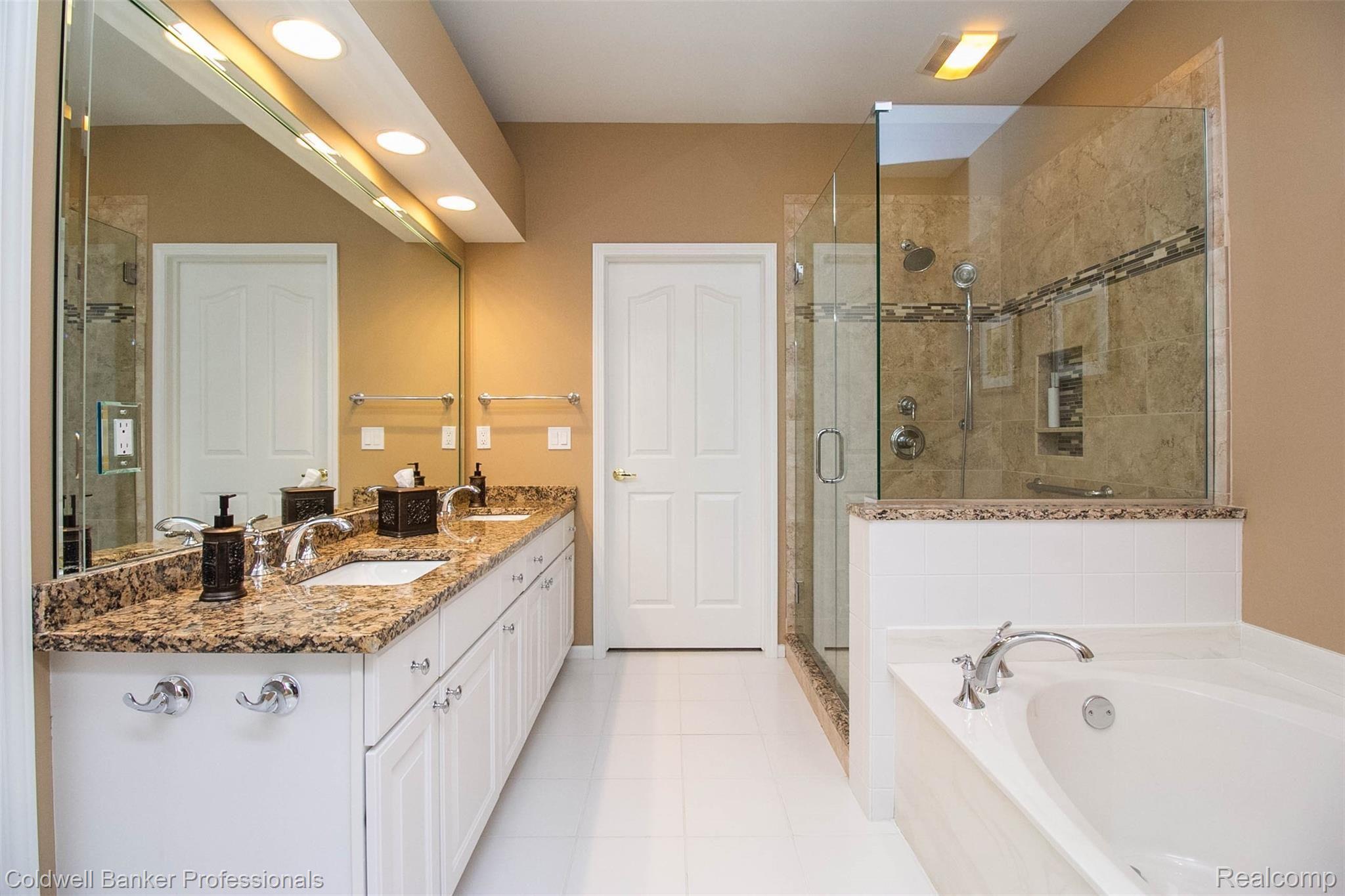 1501 Ford Court Rochester, MI 48306 - Photo 15 of 25 Updated master bath with timeless glass enclosure around shower.