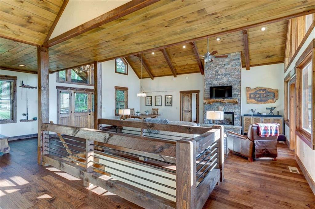 370 High Ridge Road Epworth, GA 30541 - Photo 11 of 42 a view of a dining room with furniture window and wooden floor