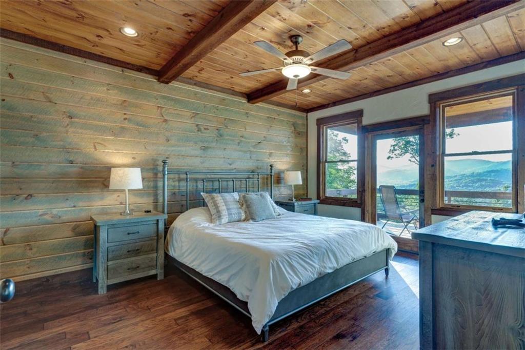 370 High Ridge Road Epworth, GA 30541 - Photo 16 of 42 a bedroom with a large bed and a large window