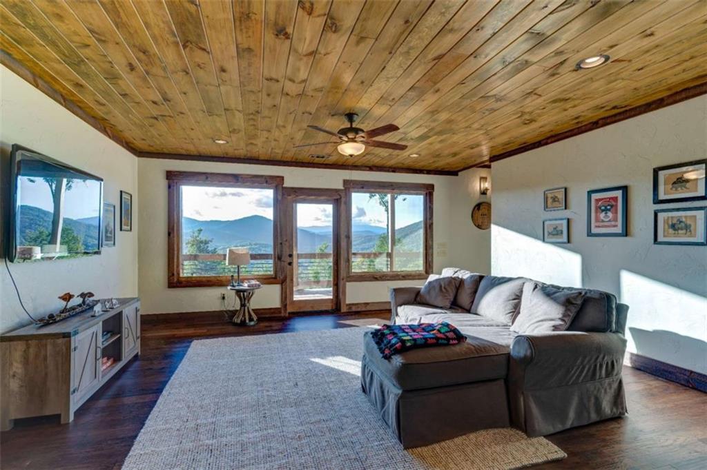 370 High Ridge Road Epworth, GA 30541 - Photo 23 of 42 a living room with furniture and a flat screen tv