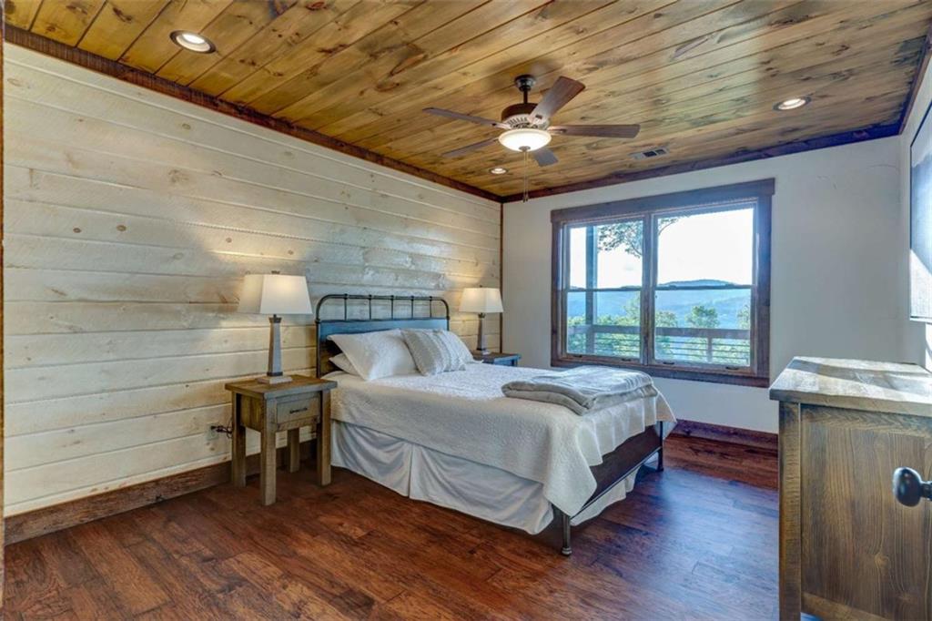 370 High Ridge Road Epworth, GA 30541 - Photo 25 of 42 a bedroom with a bed and a ceiling fan