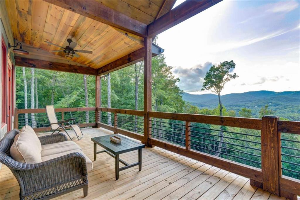 370 High Ridge Road Epworth, GA 30541 - Photo 32 of 42 a view of a patio with couches chairs wooden floor and fence