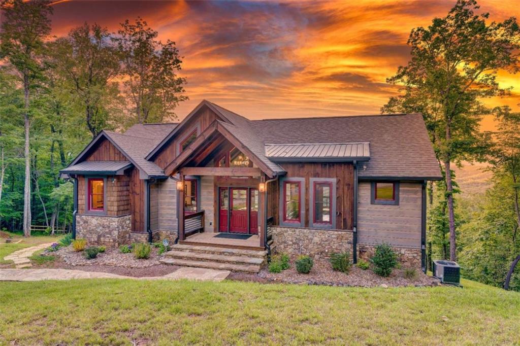 370 High Ridge Road Epworth, GA 30541 - Photo 35 of 42 a front view of a house with garden