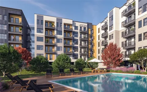 a view of a swimming pool and a yard