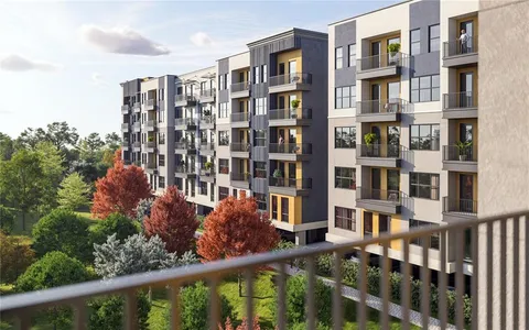 a view of a chairs and tables in the balcony