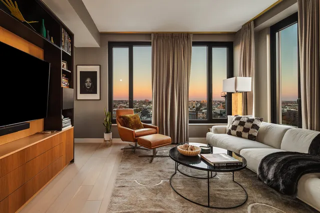 a view of a livingroom with furniture and an entryway