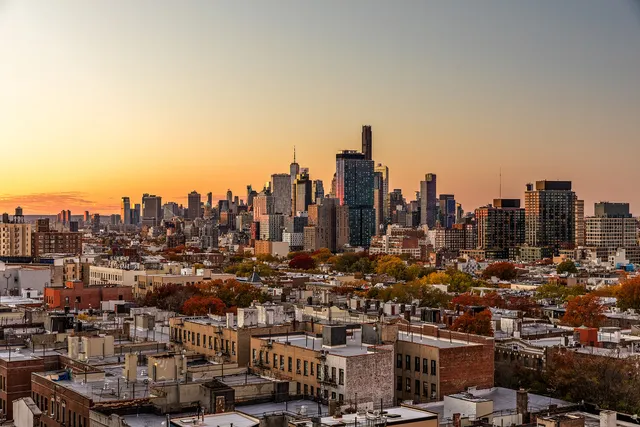 a view of a city with tall buildings