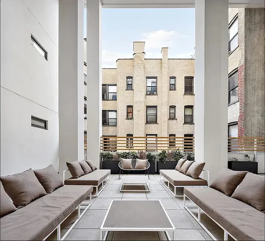 a reading room with furniture and book shelf