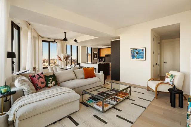 a dining room with furniture and wooden floor