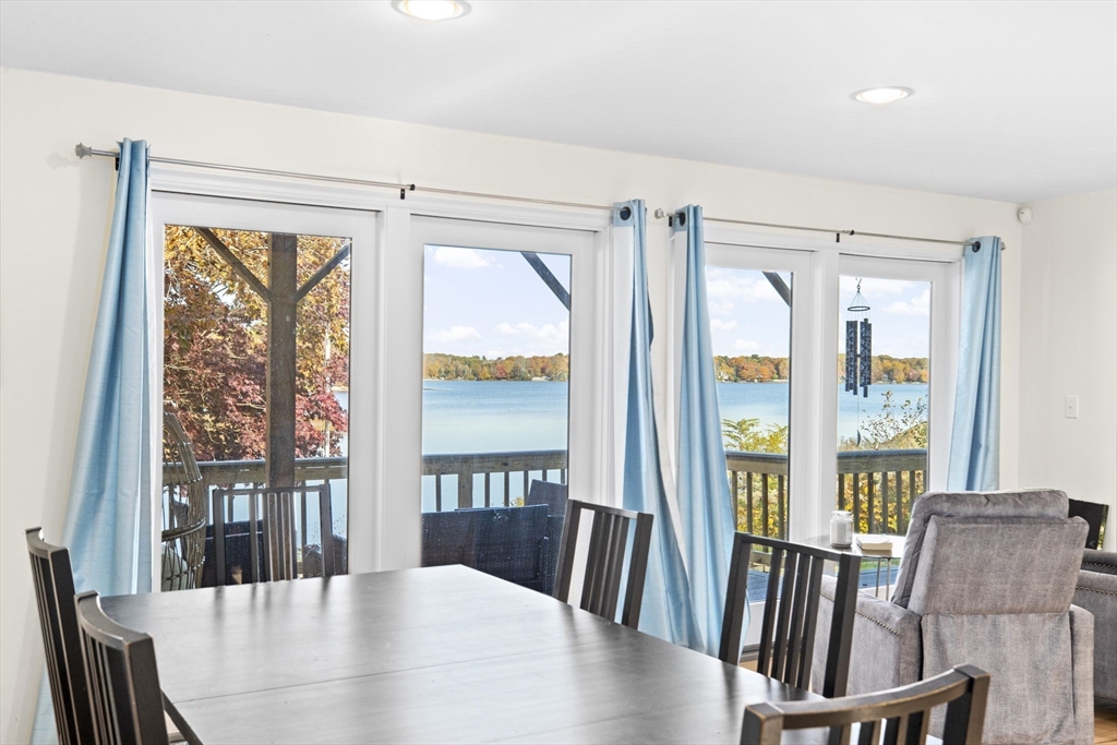 22 Beach Road Sharon, MA 02067 - Photo 12 of 27 a view of a dining room with furniture large windows and wooden floor