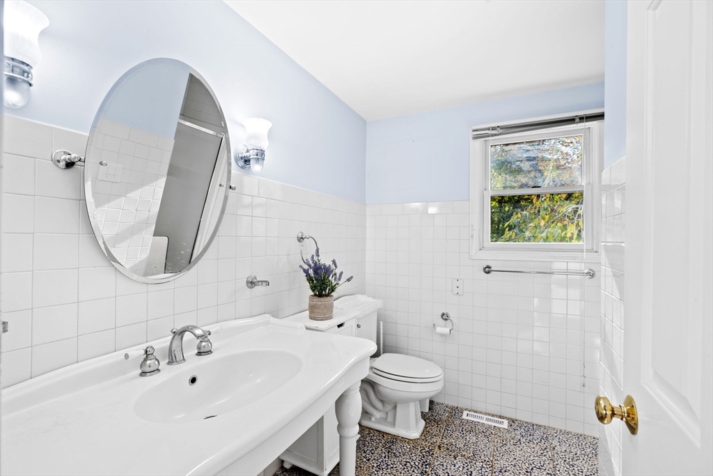 22 Beach Road Sharon, MA 02067 - Photo 17 of 27 a bathroom with a toilet sink and mirror
