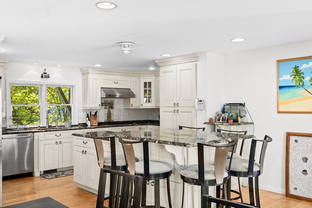 22 Beach Road Sharon, MA 02067 - Photo 9 of 27 a kitchen that has a table and chairs in it