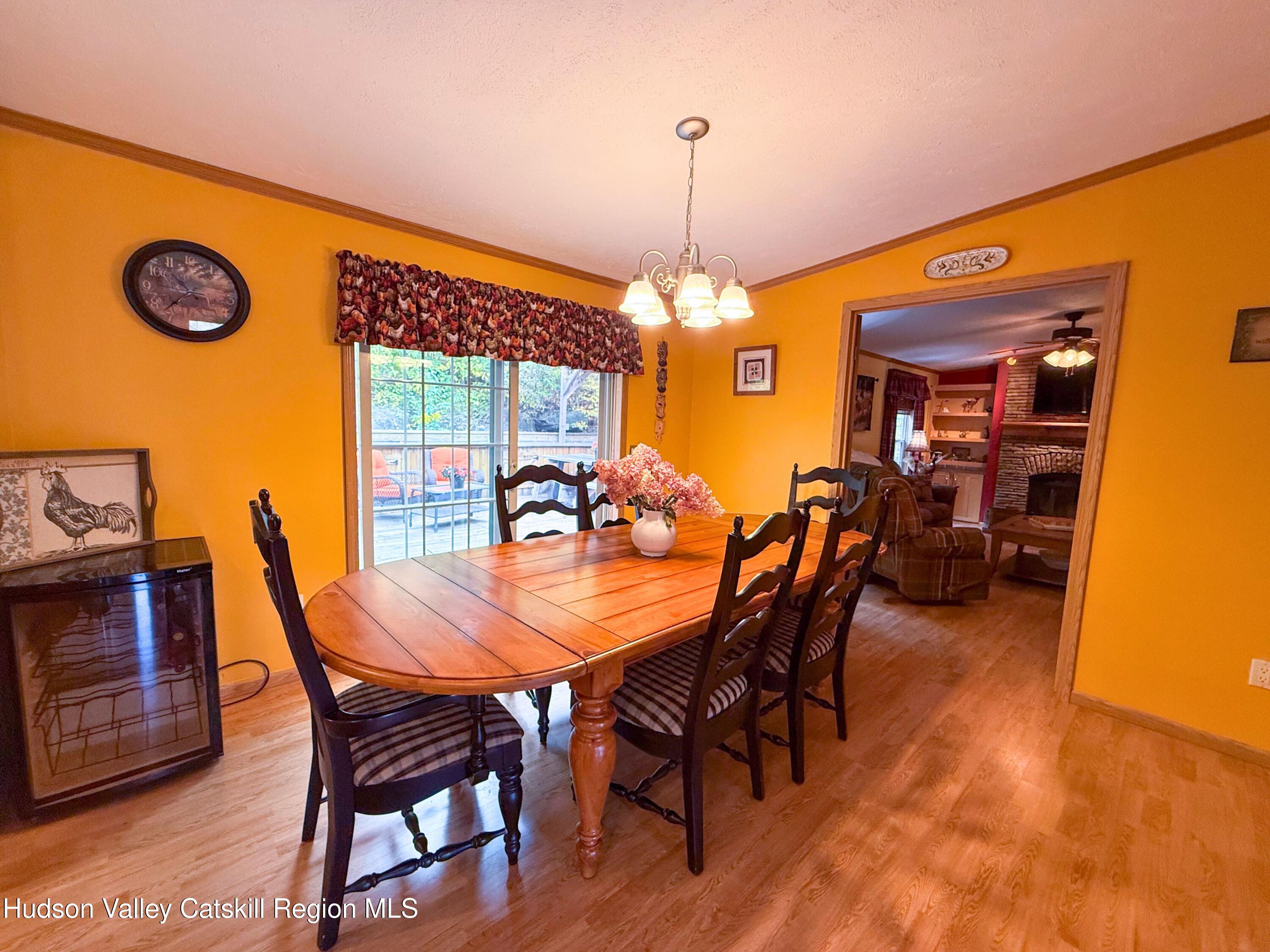 766 Hog Mountain Circle Fleischmanns, NY 12430 - Photo 18 of 31 a view of a dining room with furniture window and wooden floor