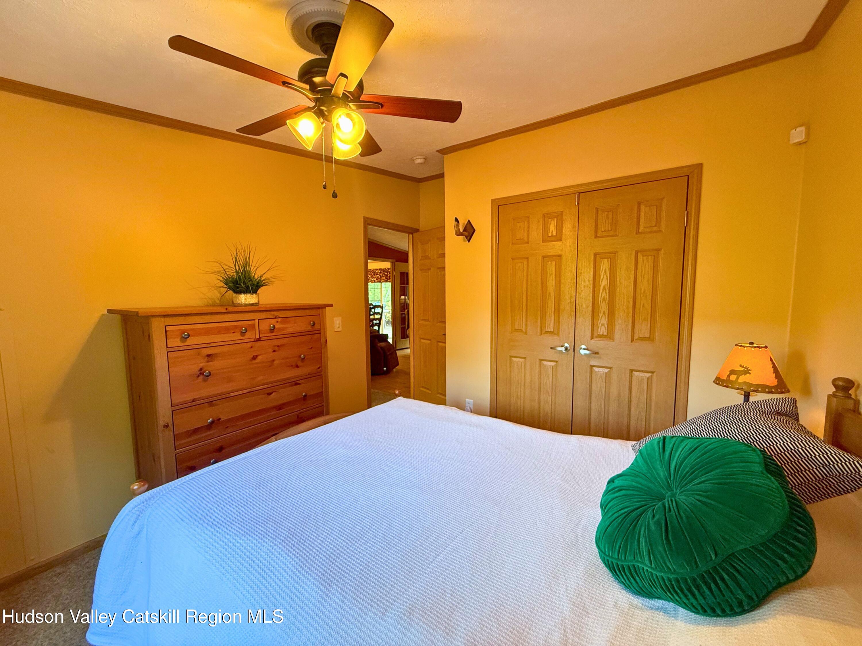 766 Hog Mountain Circle Fleischmanns, NY 12430 - Photo 19 of 31 a bedroom with a bed and a dresser
