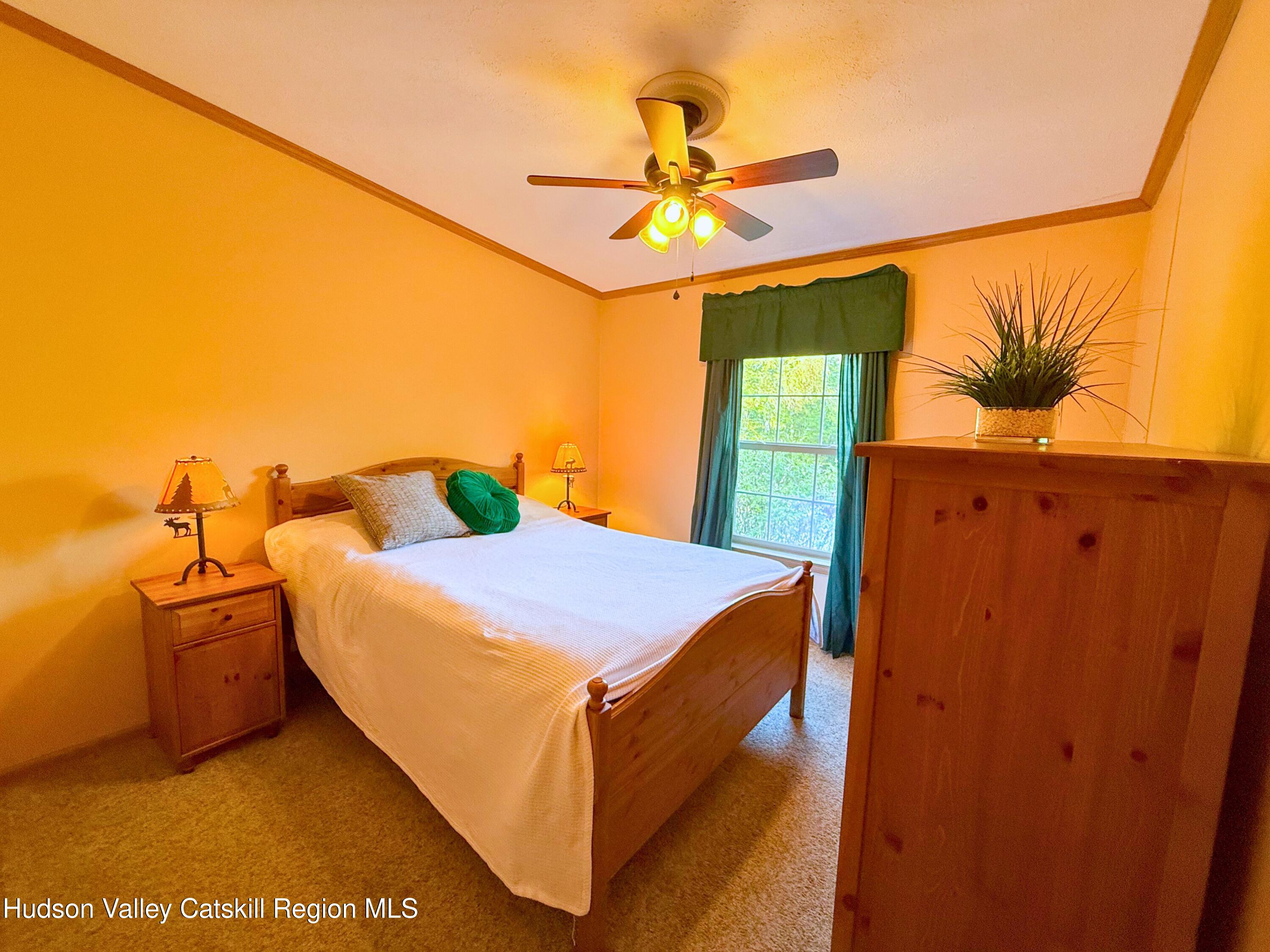 766 Hog Mountain Circle Fleischmanns, NY 12430 - Photo 20 of 31 a bed room with a bed