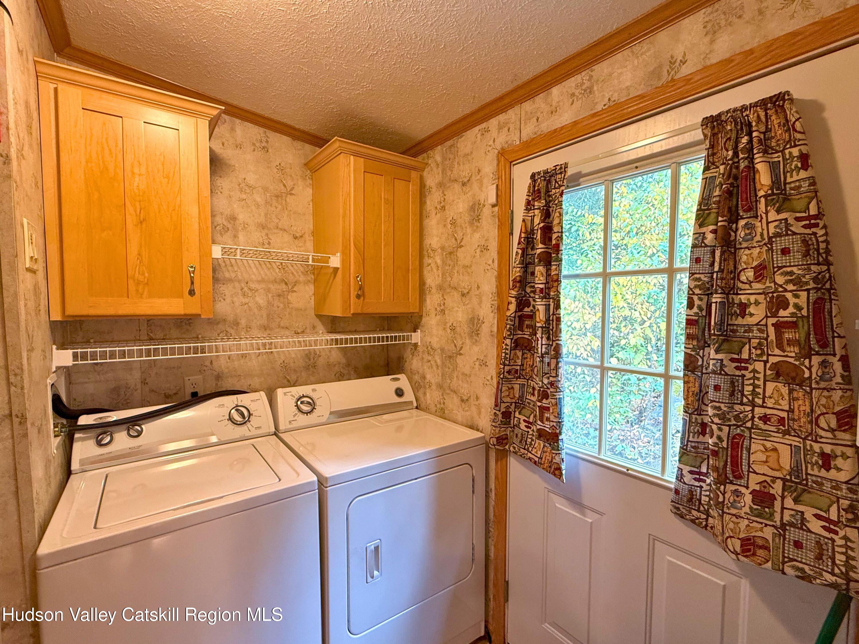 766 Hog Mountain Circle Fleischmanns, NY 12430 - Photo 24 of 31 a utility room with dryer and washer