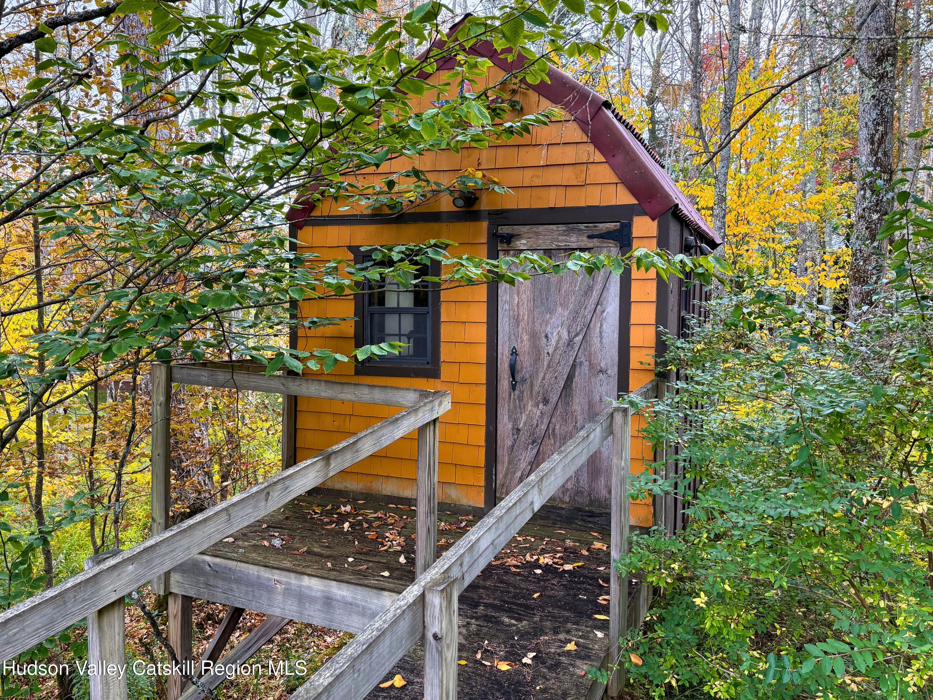 766 Hog Mountain Circle Fleischmanns, NY 12430 - Photo 25 of 31 a view of balcony with wooden stairs and potted plants