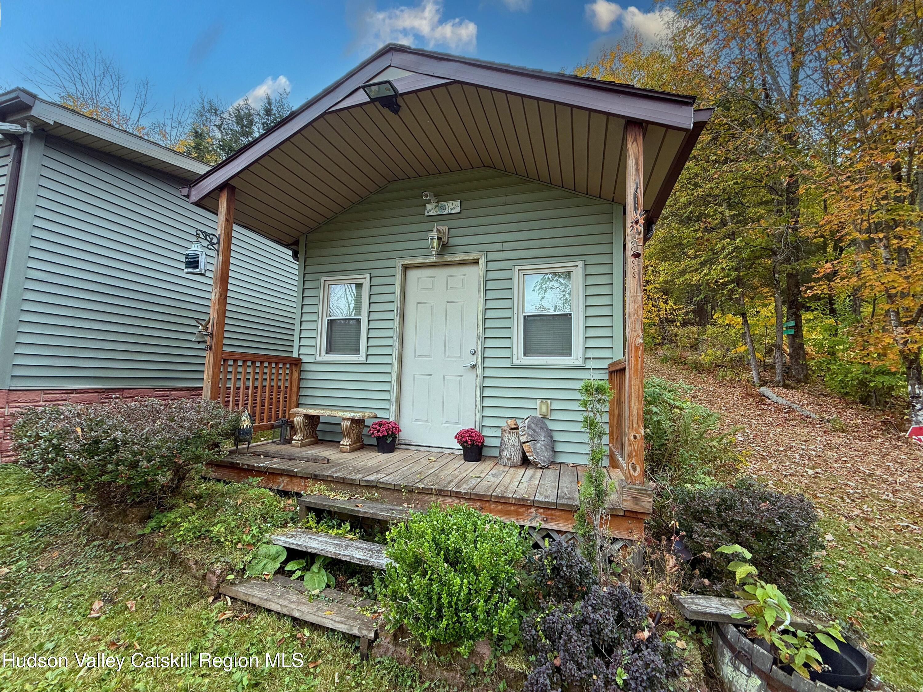 766 Hog Mountain Circle Fleischmanns, NY 12430 - Photo 26 of 31 a backyard of a house with outdoor seating