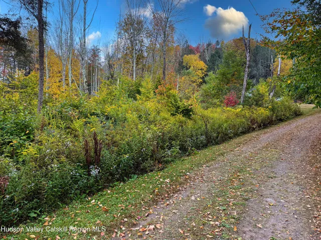 a picture of a bathroom with a shower