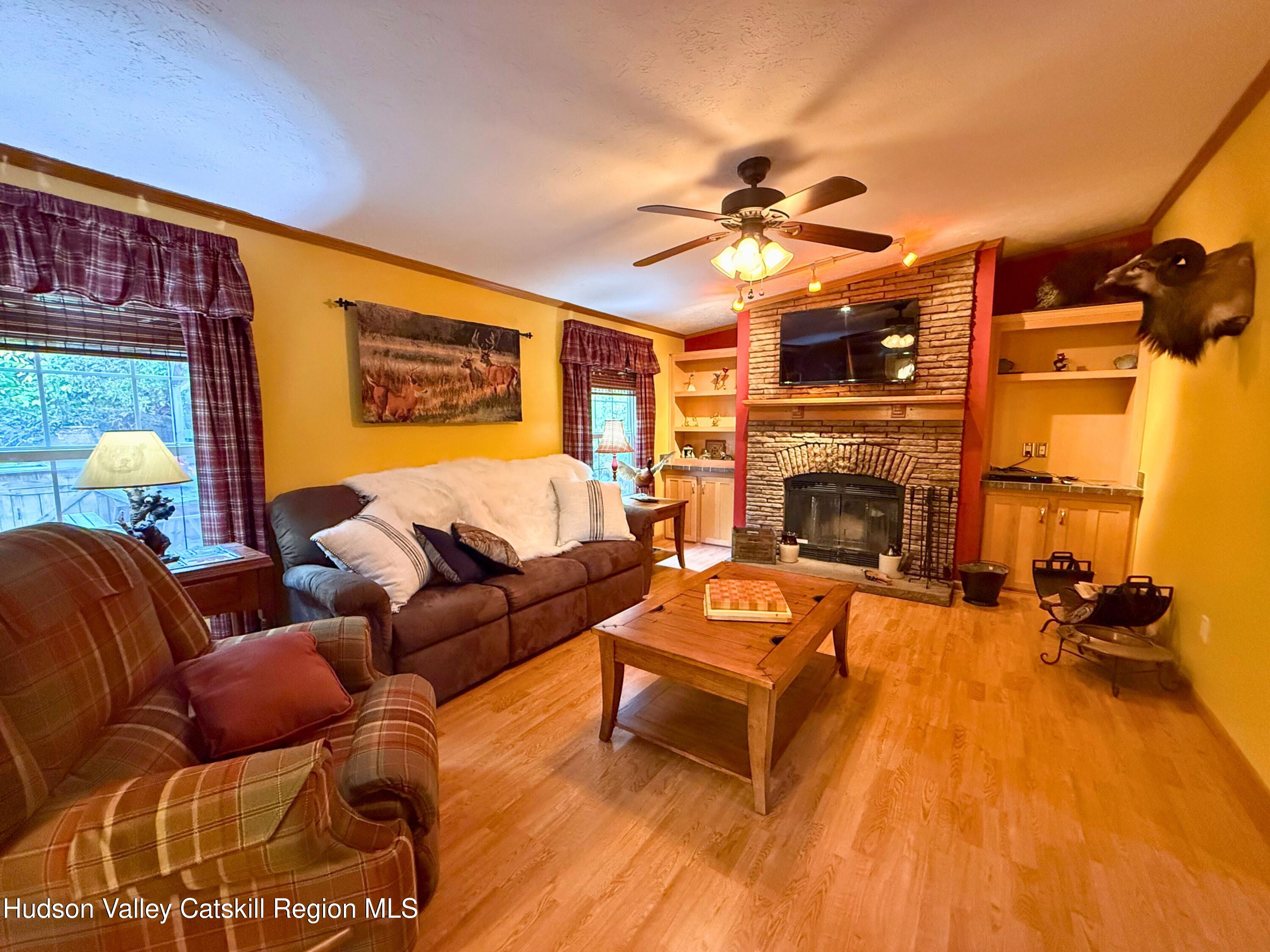 766 Hog Mountain Circle Fleischmanns, NY 12430 - Photo 5 of 31 a living room with furniture and a fireplace