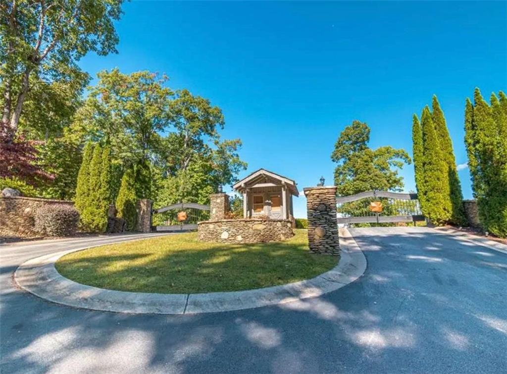 Lot 17 Staurolite Mountain Drive Blue Ridge, GA 30513 - Photo 3 of 3 a view of a house with a yard and potted plants