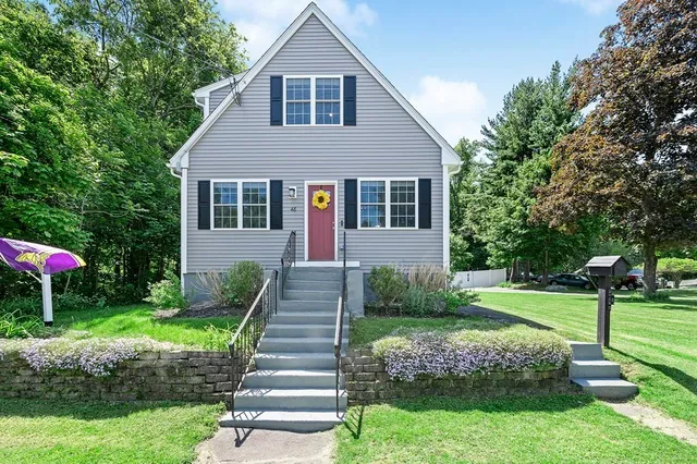 a front view of a house with a yard