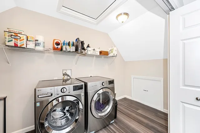 a utility room with sink dryer and washer