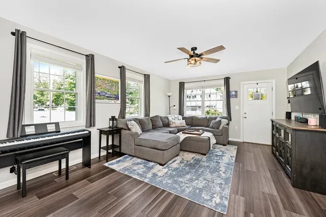 a living room with furniture and a window