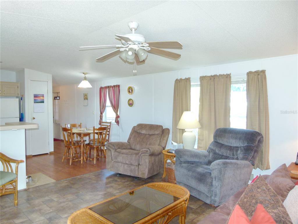 1017 1st Street Okeechobee, FL 34974 - Photo 15 of 36 a living room with furniture and a large window