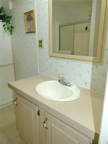 a bathroom with a sink and a mirror