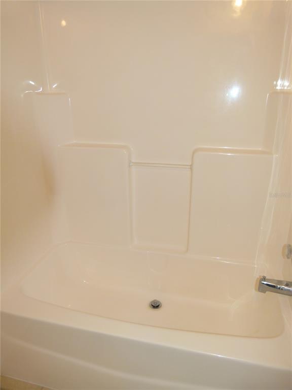 1017 1st Street Okeechobee, FL 34974 - Photo 20 of 36 a bathroom with a bathtub