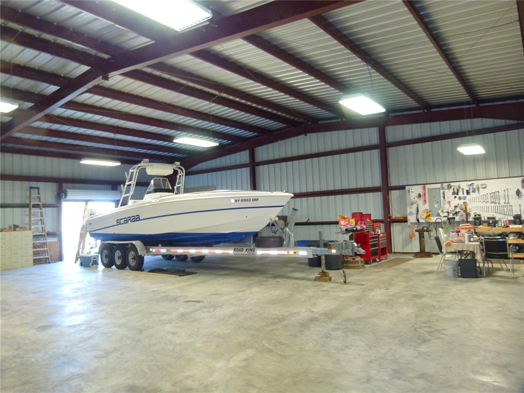 1017 1st Street Okeechobee, FL 34974 - Photo 32 of 36 a car is parked in a parking