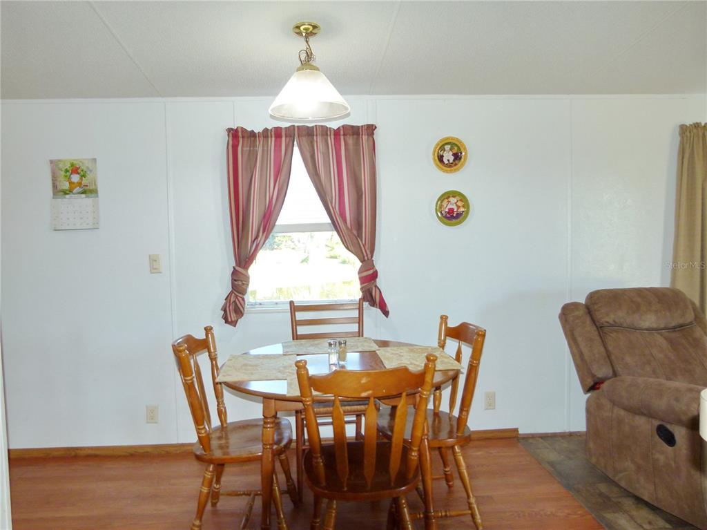 1017 1st Street Okeechobee, FL 34974 - Photo 8 of 36 a view of a dining room with furniture and window