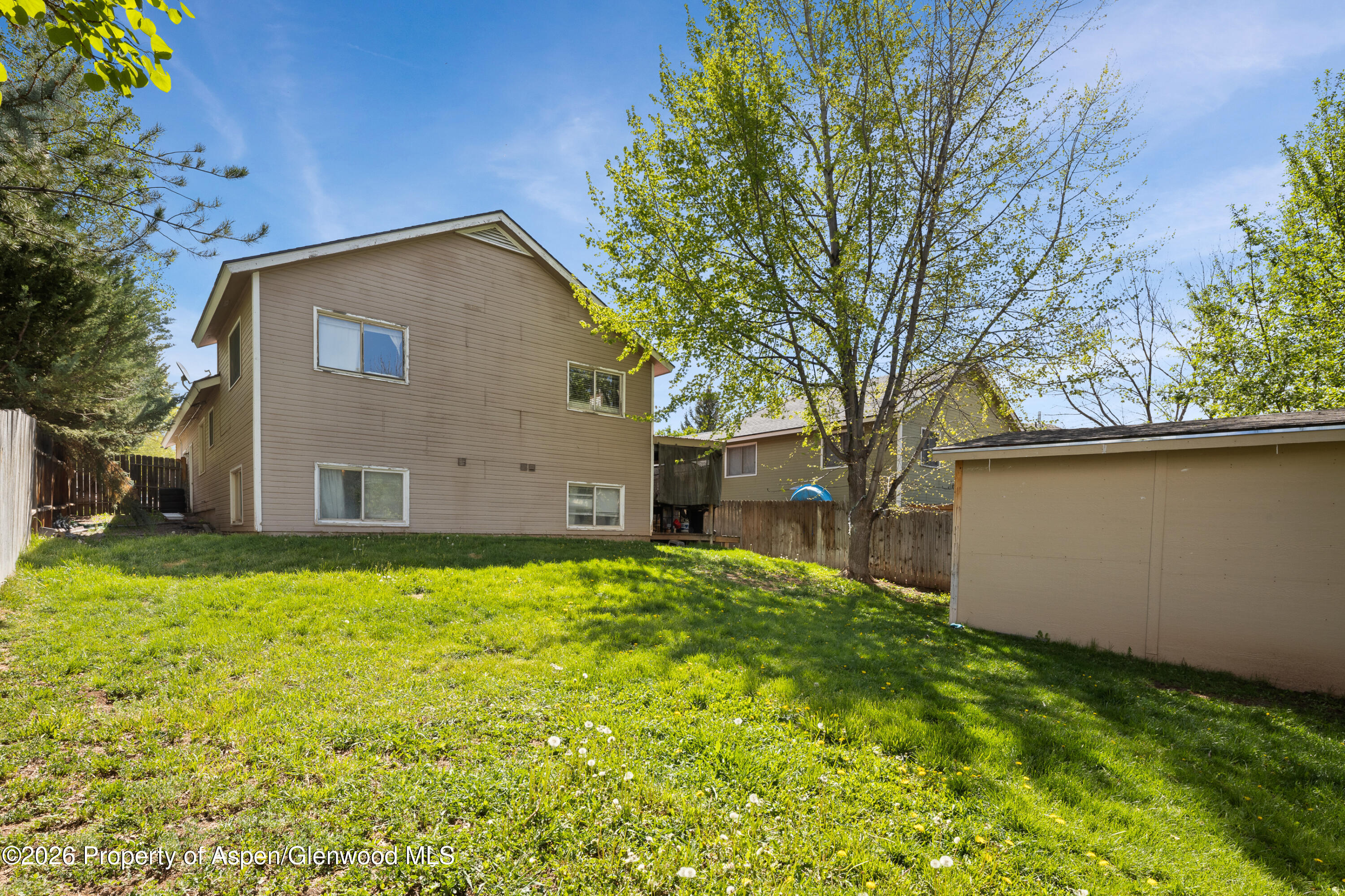 164 Current Drive New Castle, CO 81647 - Photo 33 of 34 a backyard of a house with large trees
